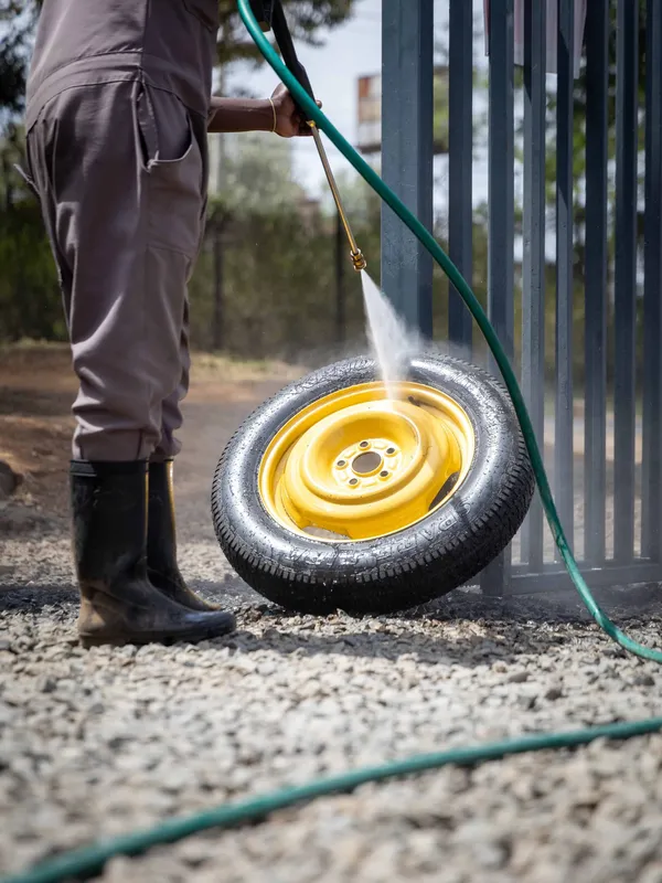 Detailed rim cleaning and polishing on a vehicle wheel